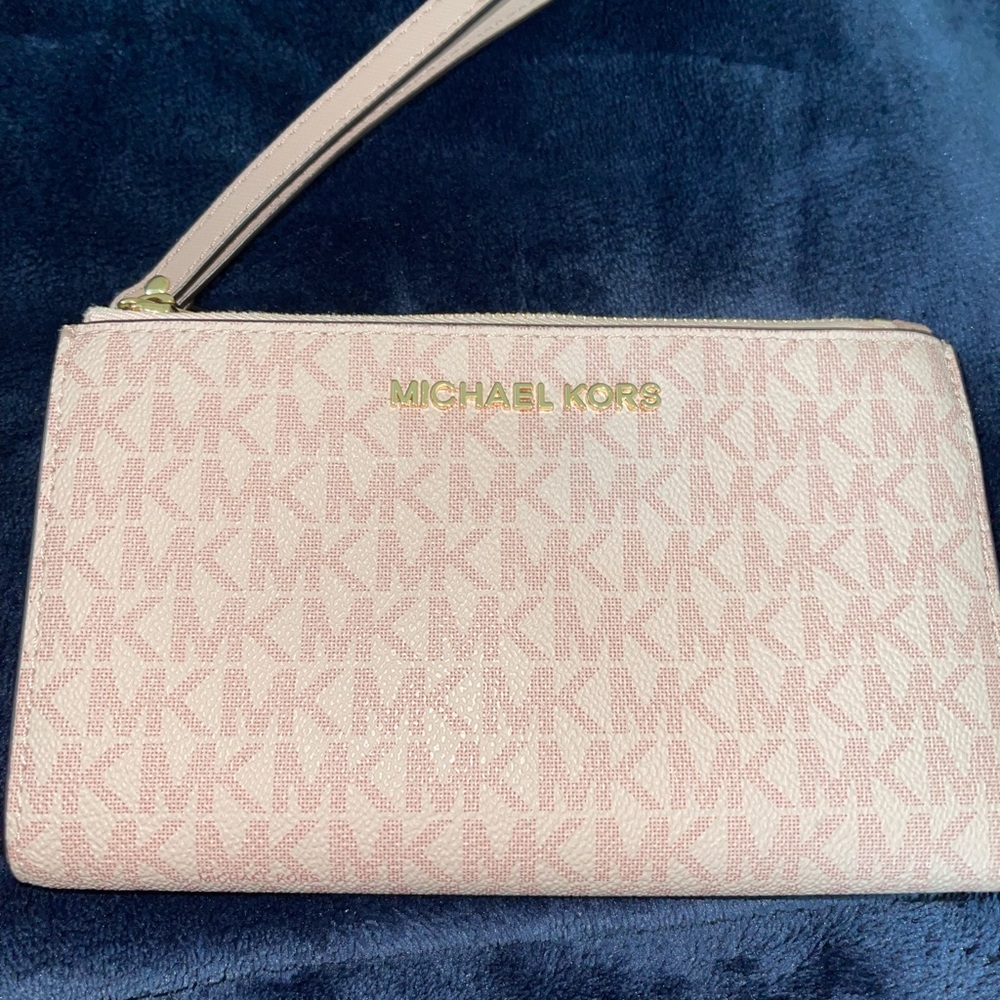 Pink Michael Kors Signature Wristlet.